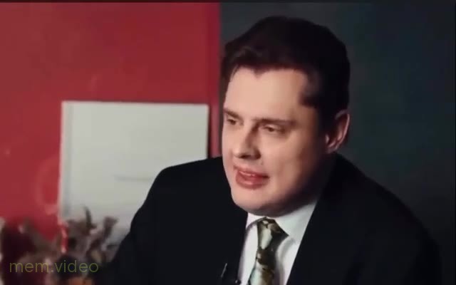 Кадр: Евгений Понасенков вздыхает в костюме на интервью