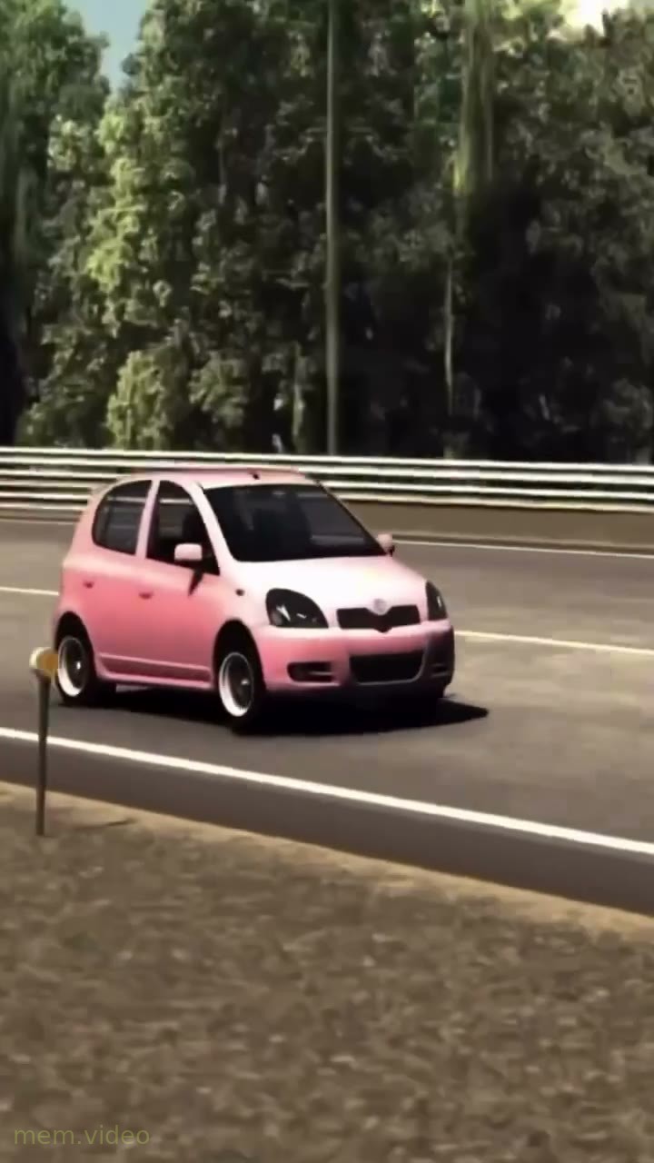 Кадр: Розовая машина Toyota едет по горной дороге