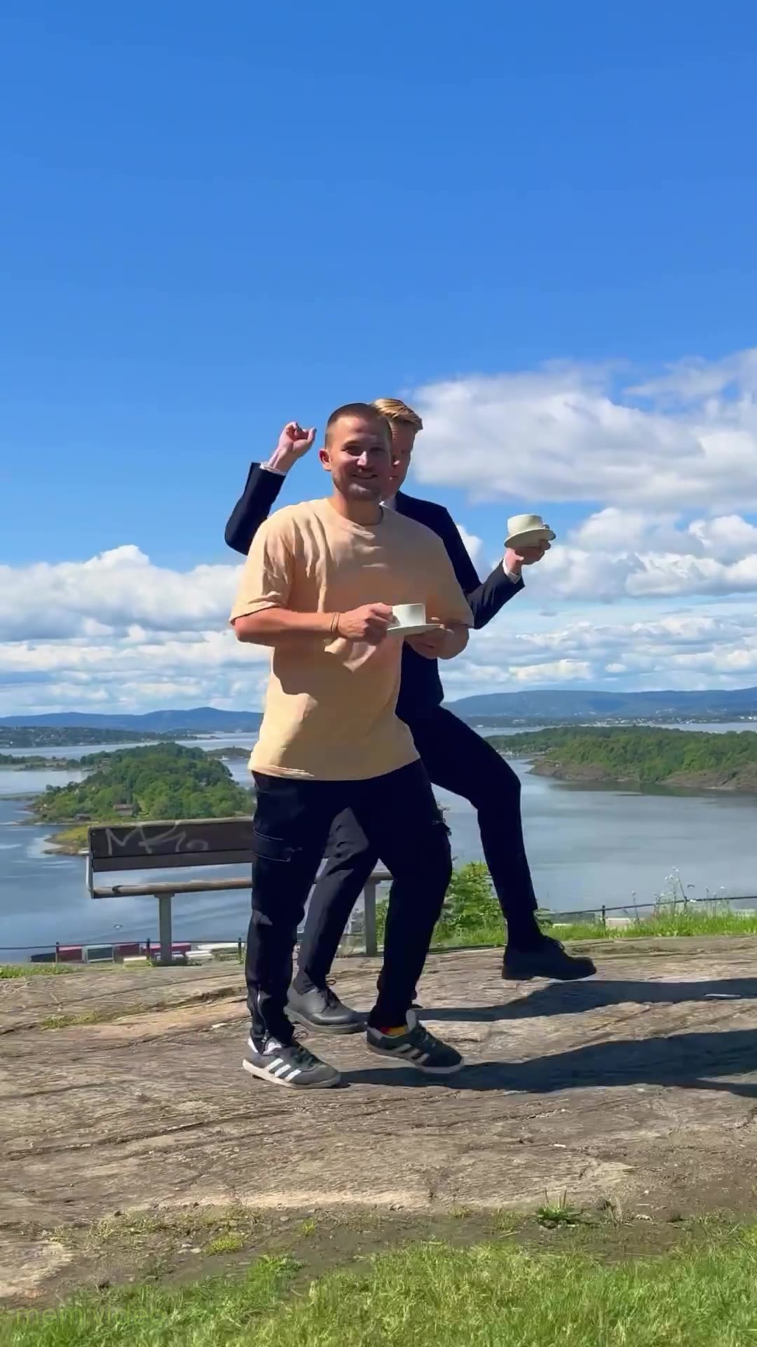 Кадр: "Whenever, wherever" — парни танцуют с чашками