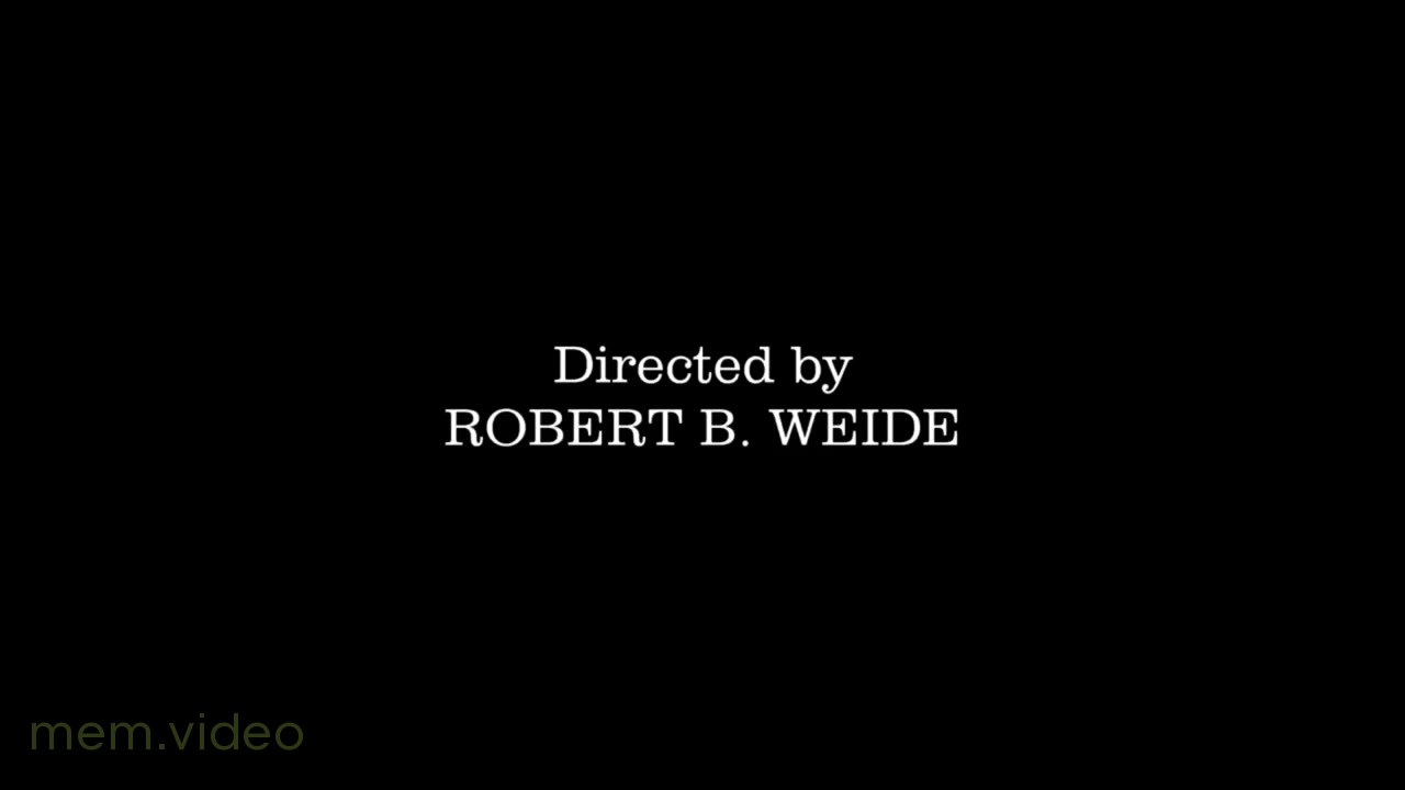 Кадр: Титры «Directed by Robert B. Weide» на чёрном фоне
